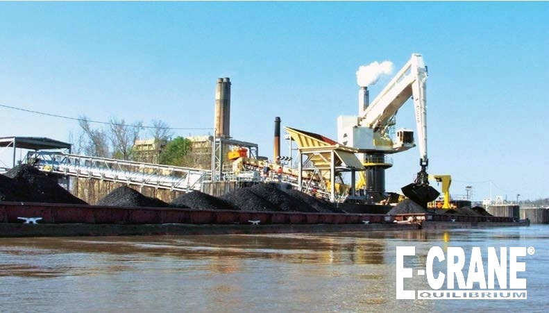 E-Crane floating terminal keeps barges and crane at the same level regardless of river fluctuations. A continuous breasting cable keeps the barges from drifting. The Lowman E-Crane has a 25-yd bucket and can unload 1500 tons per hour.