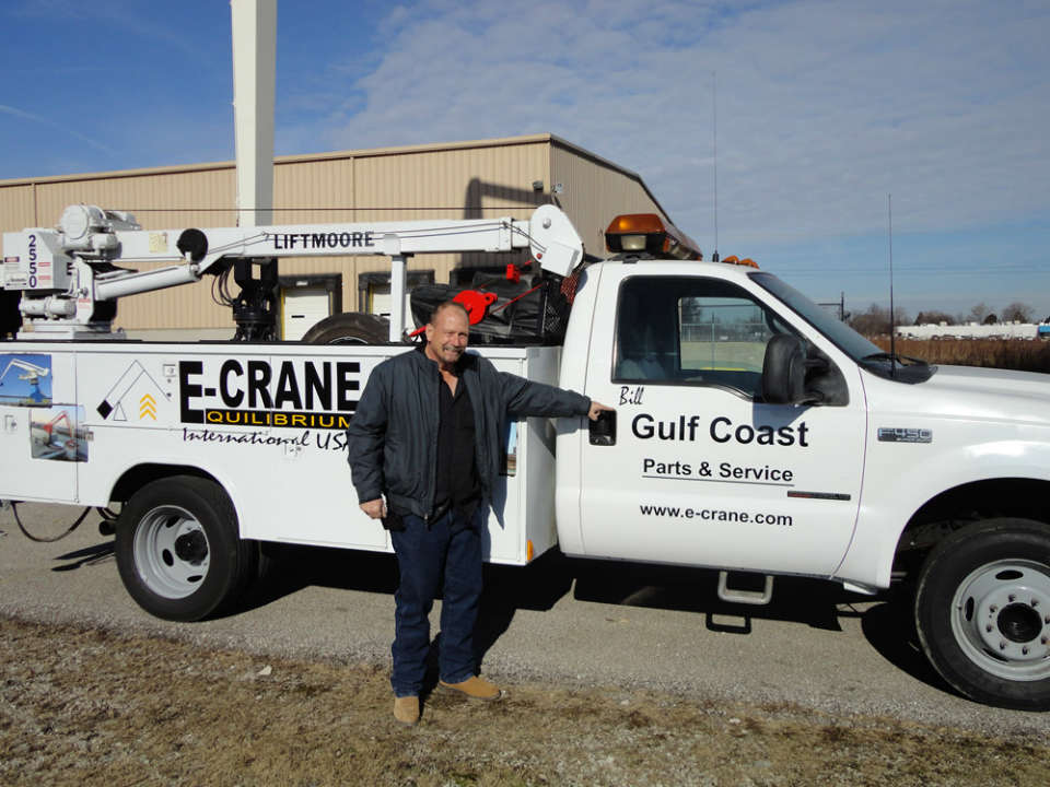 Bill McNair in front of his duty service truck